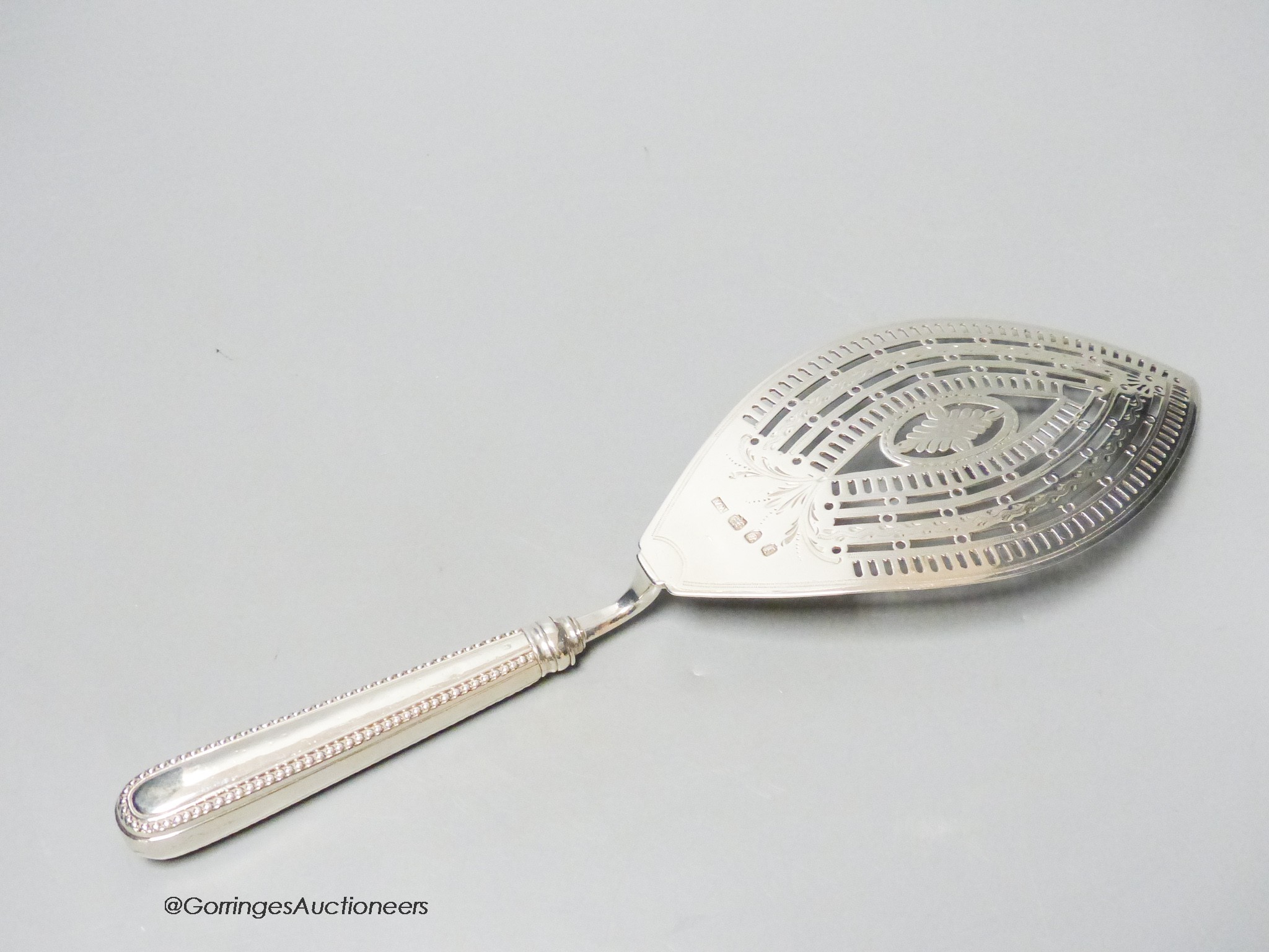 A large George IV silver fish slice, William Abdy I, London, 1784, 30.2cm, loaded handle, gross 4.5oz.